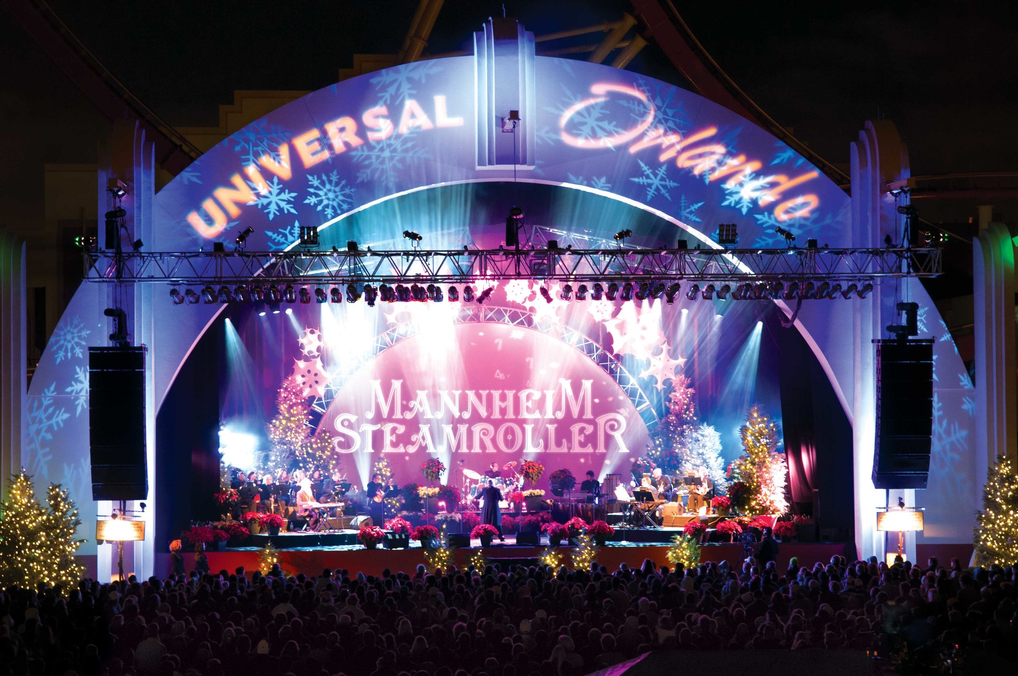universal orlando stage at night with spotlights and mannheim steamroller playing music